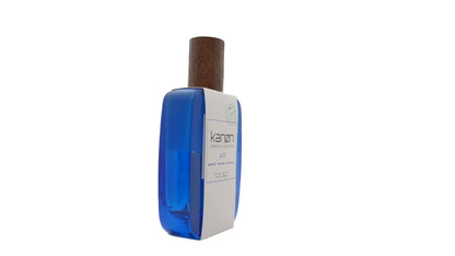 Paradime Enterprise LLC Kanon Elements Air Eau de Toilette in a blue glass bottle with a wooden cap.