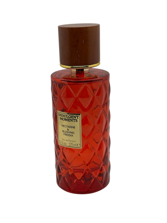 Paradime Enterprise LLC Indulgent Moments Lavender & Honeysuckle EDP in a purple quilted glass bottle with wood cap.
