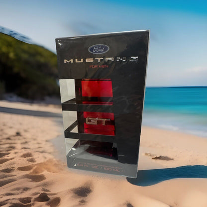 Paradime Enterprise LLC Mustang GT 3.4 oz Eau de Toilette fragrance bottle in black and red packaging on a beach