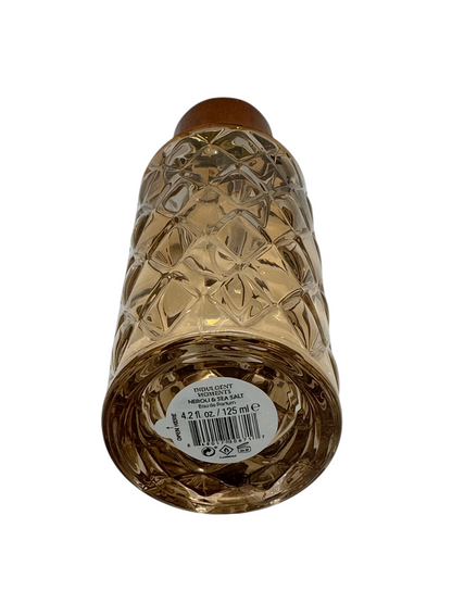 Paradime Enterprise LLC Indulgent Moments Neroli and Sea Salt perfume bottle base with label and diamond-cut glass