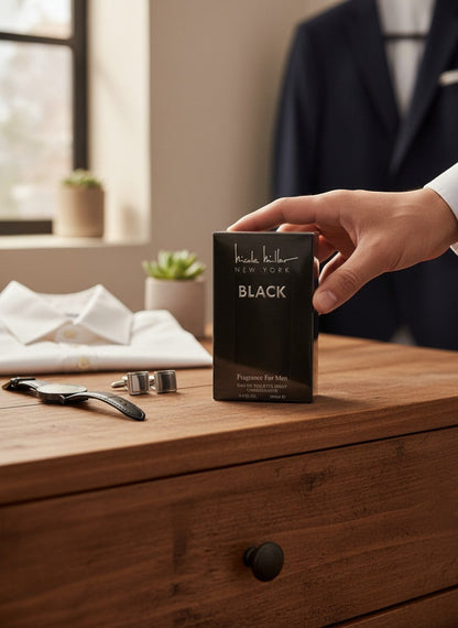 Paradime Enterprise LLC Nicole Miller Black 3.4 oz EDT spray for men on a wooden dresser with formal accessories