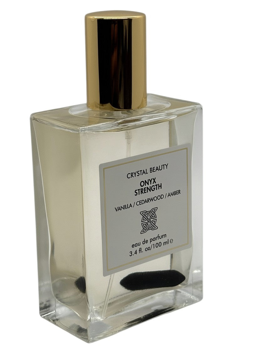Paradime Enterprise LLC Crystal Beauty Onyx Strength perfume bottle with a gold cap and an onyx crystal inside.