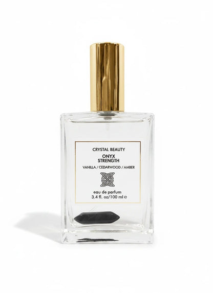 Paradime Enterprise LLC Crystal Beauty Onyx Strength eau de parfum in a glass bottle with a gold cap and onyx crystal.