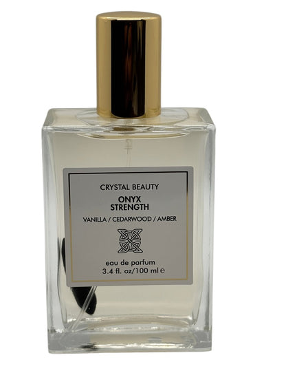 Paradime Enterprise LLC Crystal Beauty Onyx Strength perfume bottle with a gold cap and visible onyx crystal inside.