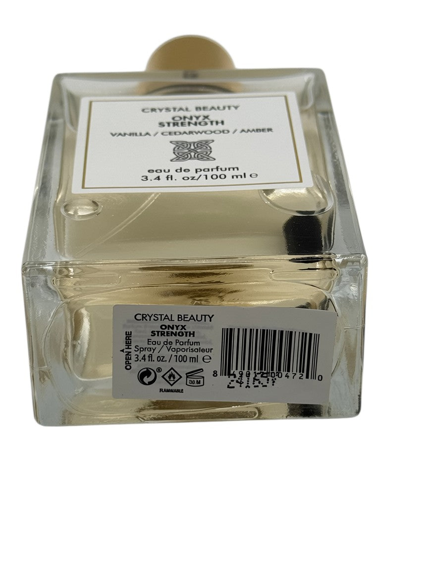 Paradime Enterprise LLC Crystal Beauty Onyx Strength perfume bottle with gold cap and visible crystal inside