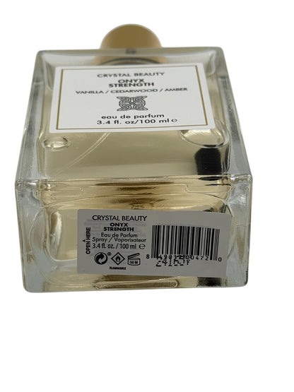 Paradime Enterprise LLC Crystal Beauty Onyx Strength perfume bottle with gold cap and visible crystal inside
