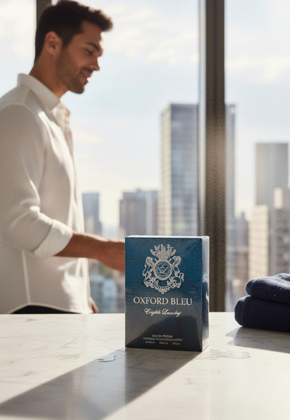 Paradime Enterprise LLC English Laundry Oxford Bleu Eau de Parfum bottle on a marble counter with a man in the background