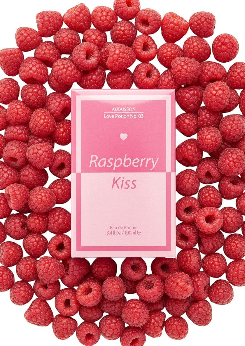 Paradime Enterprise LLC Aubusson Love Potion No. 03 Raspberry Kiss perfume box surrounded by fresh red raspberries.