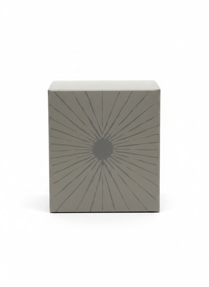 Paradime Enterprise LLC TOVA Beverly Hills candle box in grey with a sunburst graphic design on a white background
